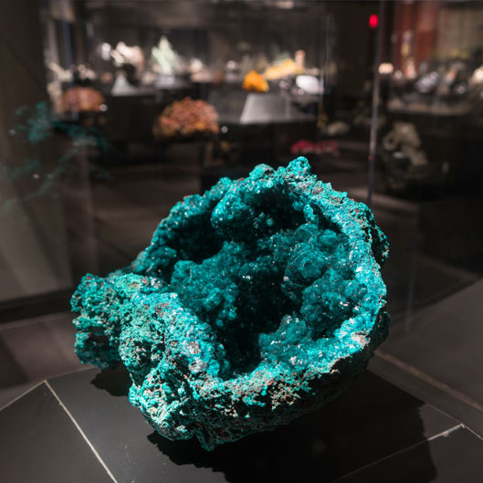 A large, bright green mineral deposit.