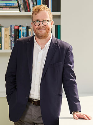a portrait photo of Eric Crosby