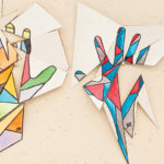 A student's artwork of colorful hands.