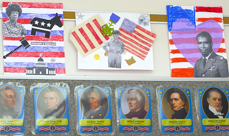Bulletin board in classroom with student artwork.