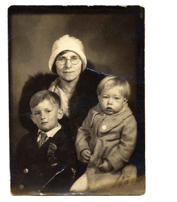 A vintage photo of a mother with 2 small children