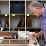 Portrait of Dale Luce at work in the Carnegie Museum of Art's framing room.