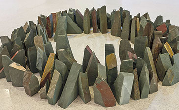 A circular formation made from earth-tone colored stones.