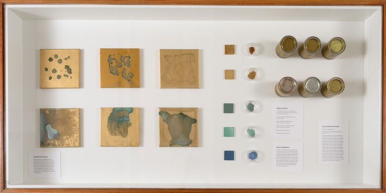 An ariel view of a display of objects in a glass covered table.