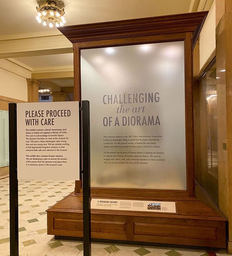 A diorama with warning signs and frosted windows to prevent viewing.