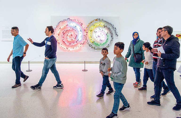 An immigrant family touring the art museum.