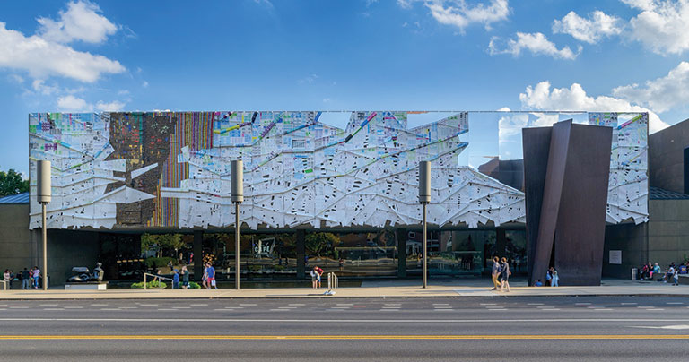 The front facade of the Museum of Art covered in tin printing plates.