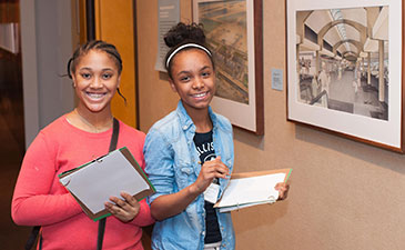 Two young Black girls in the museum of art