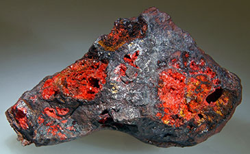 A gray and red colored mineral