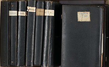 A group of small black books
