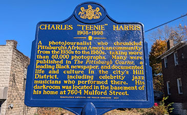 Historical marker honoring Charles "Teenie" Harris, a photojournalist documenting Pittsburgh's African American community from 1930s-1980s.